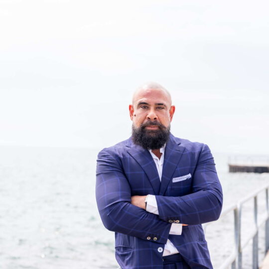 rahul malhotra standing by lighthouse